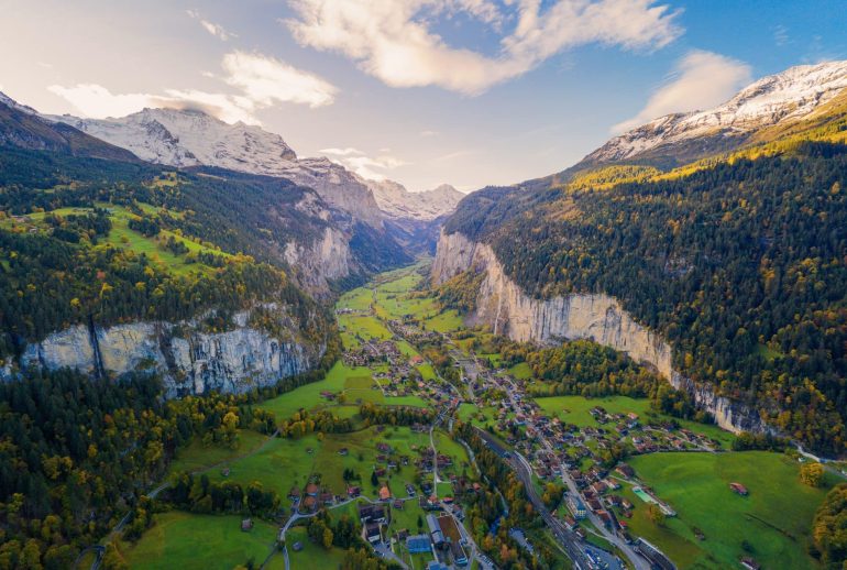 Aerial view of traditional swiss villages in Lauterbrunnen valley Switzerland with autumn colors